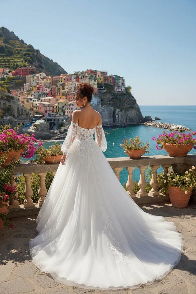 Robe Paul & Nathalie 27PN07 en tulle à manches longues dans un village de bord de mer